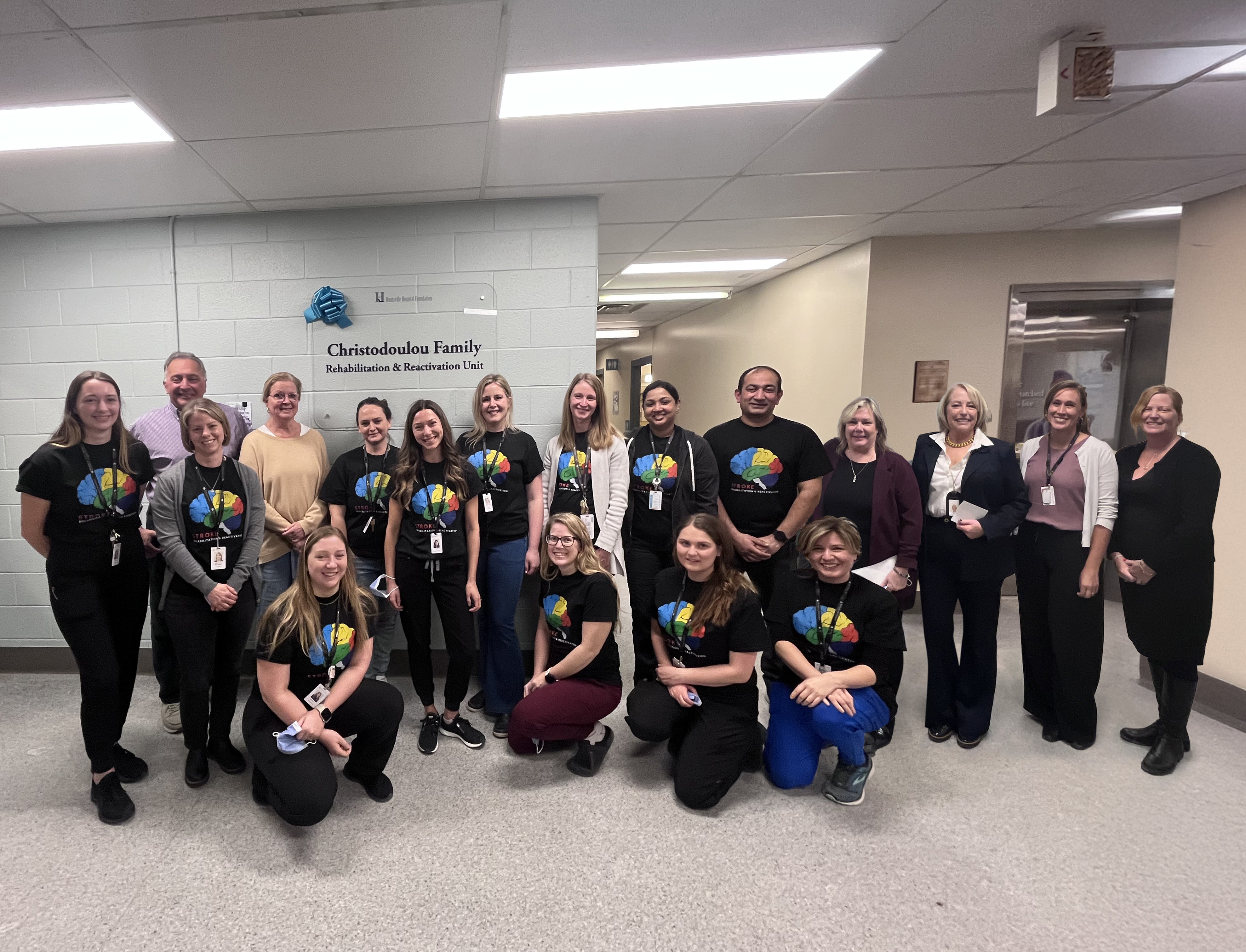 Rehabilitation staff gathered with donors and hospital administration.