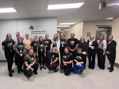 Rehabilitation staff gathered with donors and hospital administration.